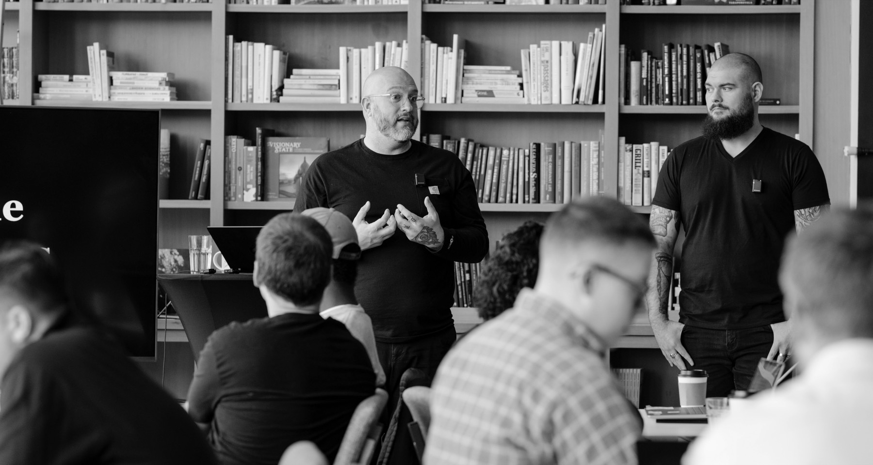 Darrell Vesterfelt and Corey Wilks leading a working session with a room of founders.